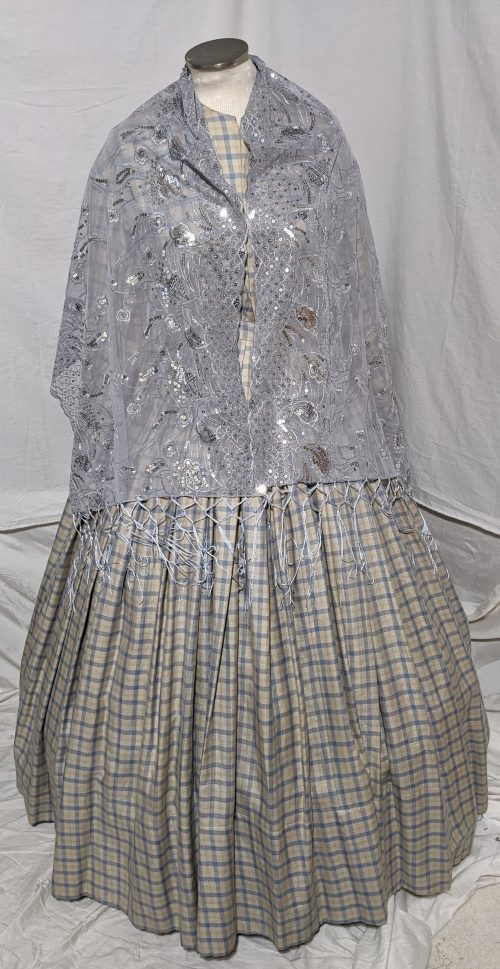 Sheer wrap with embroidery and sequins.
